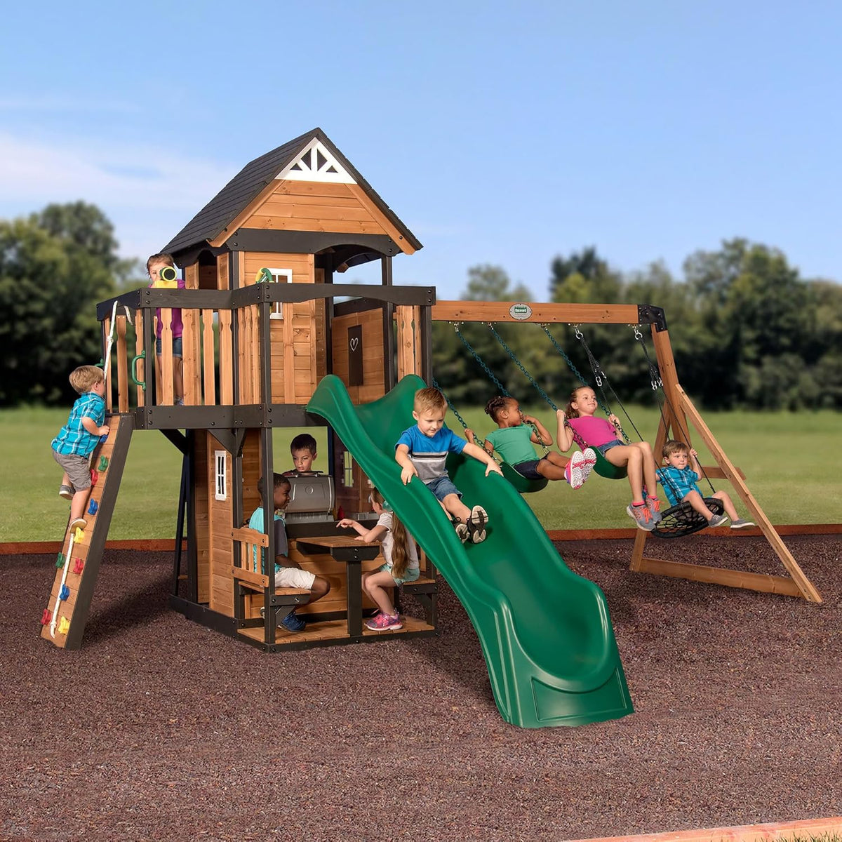 Backyard Discovery Canyon Creek Cedar Wood Swing Set with Wave Slide. Clubhouse. Play Kitchen. Picnic Area. Belt Swings. Web Swing. Rock Wall. Balconies. Playhouse. Step Ladder. Outdoor Playset - Green Slide